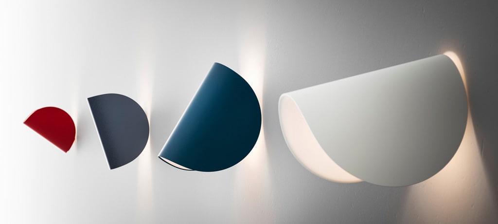 Four lighting fixtures with folded colorful covers